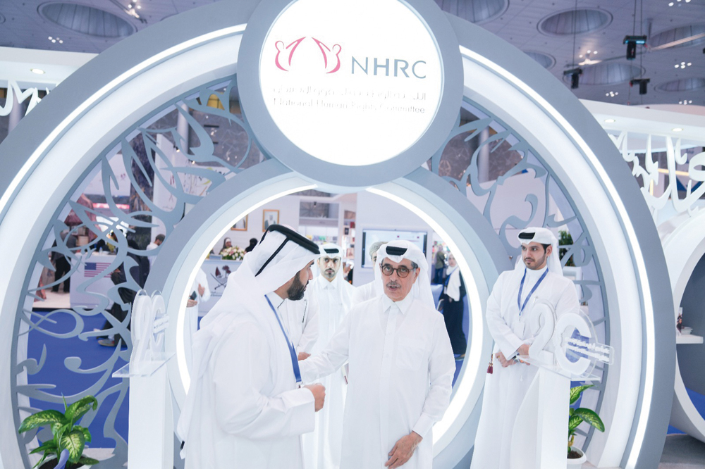Minister of State and President of Qatar National Library H E Hamad bin Abdulaziz Al Kawari  (second right) visits the NHRC stand at the DIBF.