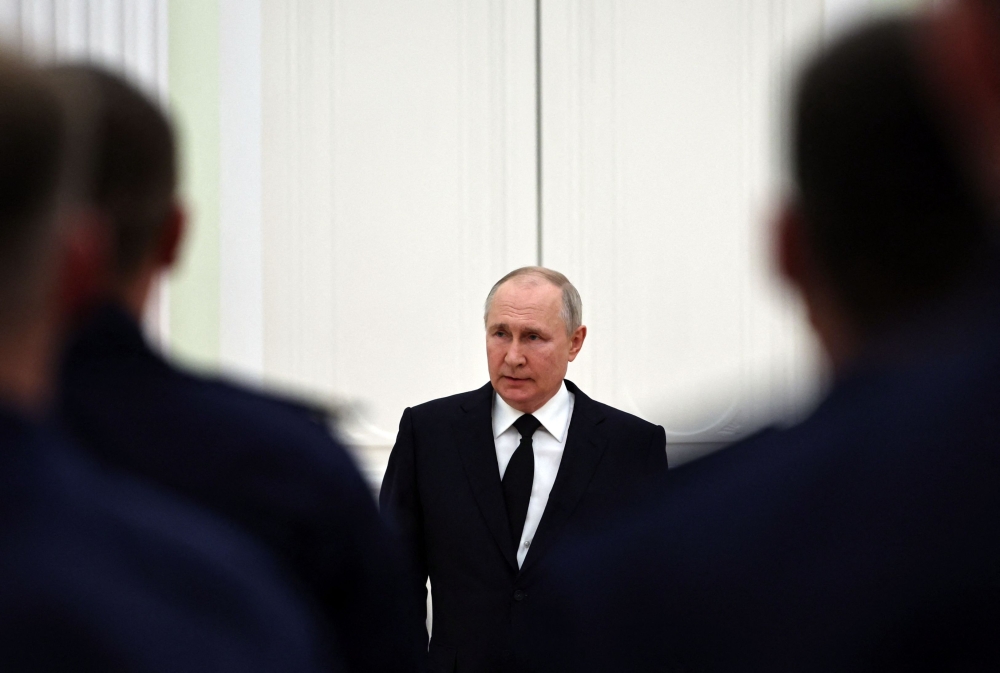 Russian President Vladimir Putin meets with servicemen at the Kremlin in Moscow on June 27, 2023. (Photo by Mikhail Tereshchenko / SPUTNIK / AFP)
