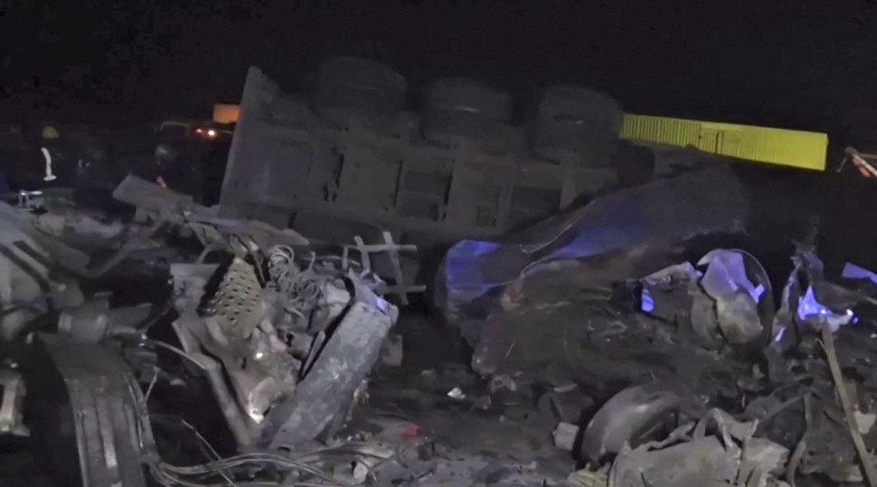 This video grab taken from an AFPTV video on June 30, 2023 shows the wreckage from vehicles on the scene after an accident on the highway between the towns of Kericho and Nakuru. (Photo by AFPTV / AFP)