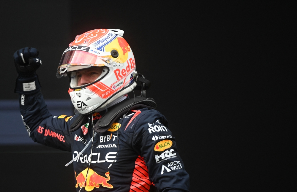 Winner Red Bull Racing's Dutch driver Max Verstappen celebrates after the Formula One Austrian Grand Prix at the Red Bull race track in Spielberg, Austria on July 2, 2023. (Photo by VLADIMIR SIMICEK / AFP)