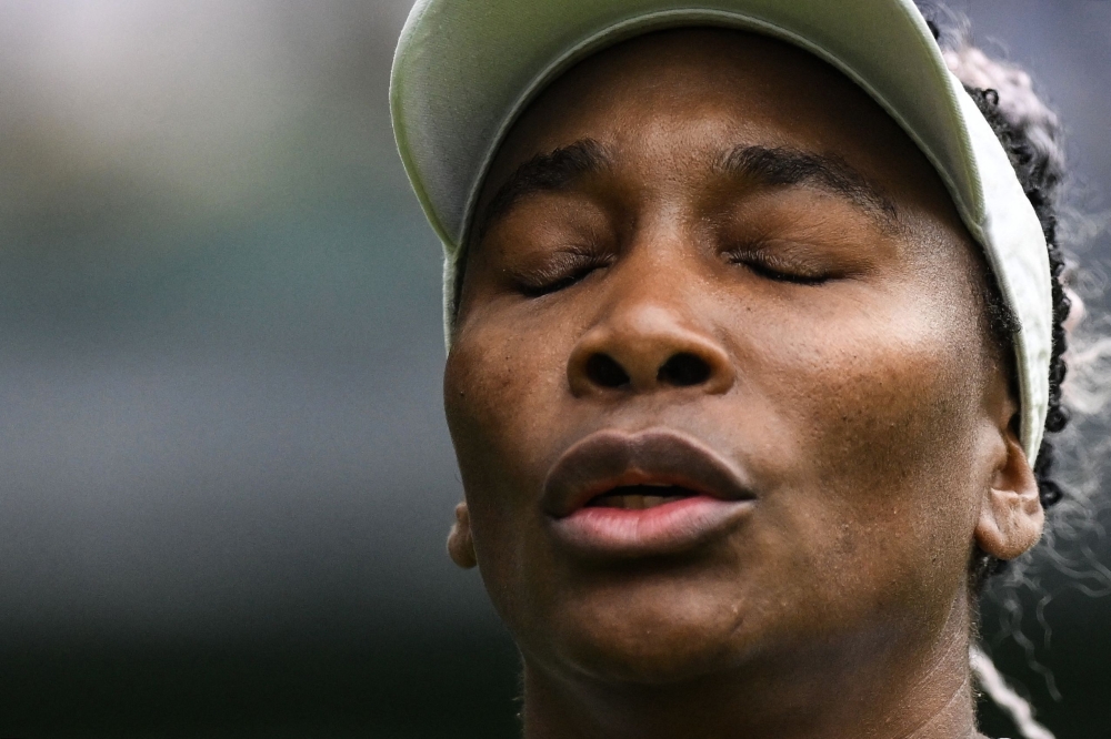 US player Venus Williams reacts as she plays against Ukraine's Elina Svitolina during their women's singles tennis match on the first day of the 2023 Wimbledon Championships at The All England Tennis Club in Wimbledon, southwest London, on July 3, 2023. (Photo by Daniel Leal / AFP)