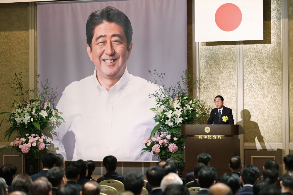 Japan's Prime Minister Fumio Kishida delivers a speech during a memorial service on the first death anniversary of former prime minister Shinzo Abe, at Meiji Kinenkan in Tokyo on July 8, 2023. (Photo by JIJI PRESS / AFP)