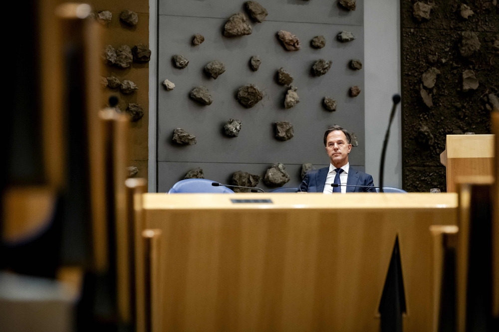 Outgoing Prime Minister Mark Rutte looks on during a debate on the fall of the cabinet at the House of Representatives in The Hague, on July 10, 2023. Photo by Robin van Lonkhuijsen / ANP / AFP