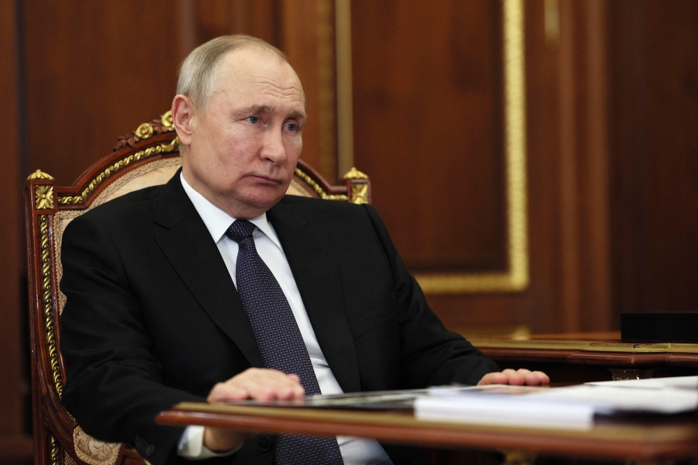 Russian President Vladimir Putin meets with head of the Udmurt Republic at the Kremlin in Moscow on July 10, 2023. (Photo by Alexander Kazakov / SPUTNIK / AFP)