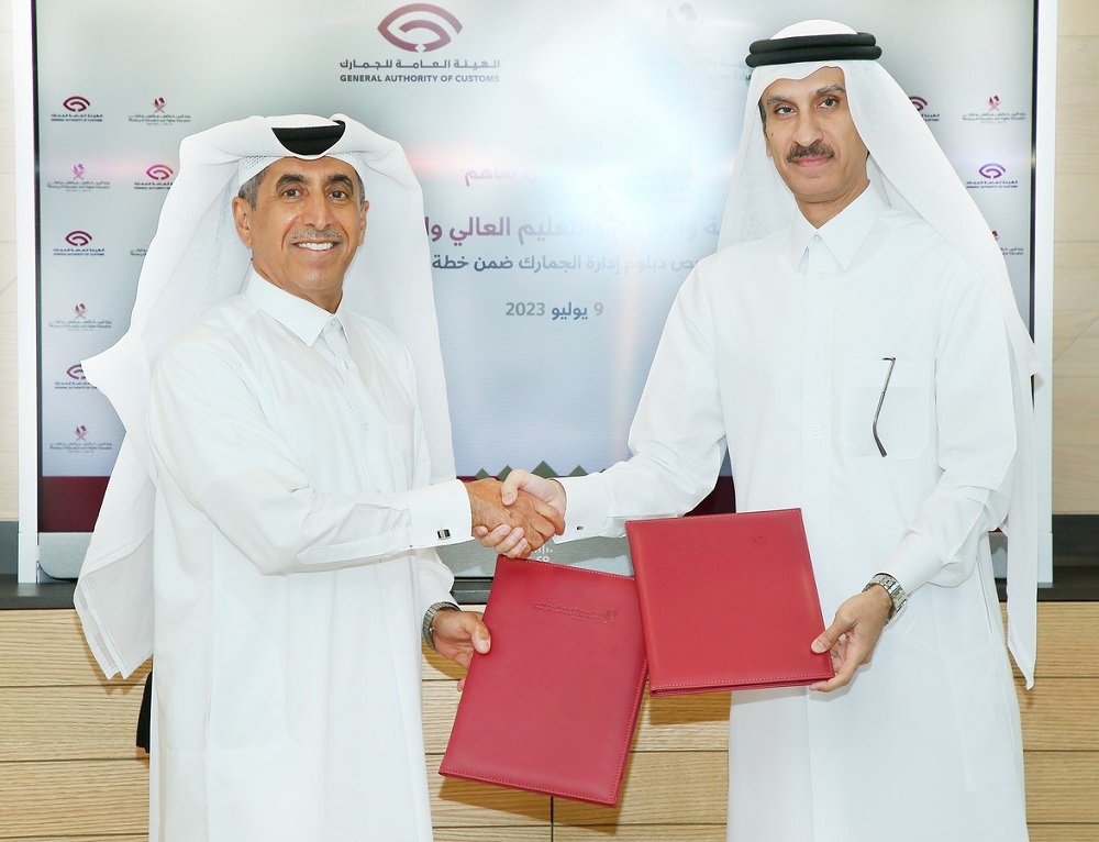Undersecretary of the Ministry of Education and Higher Education Dr. Ibrahim bin Saleh Al Nuaimi and Chairperson of the GAC Ahmed bin Abdullah Al Jamal exchanging documents after singing the agreement.