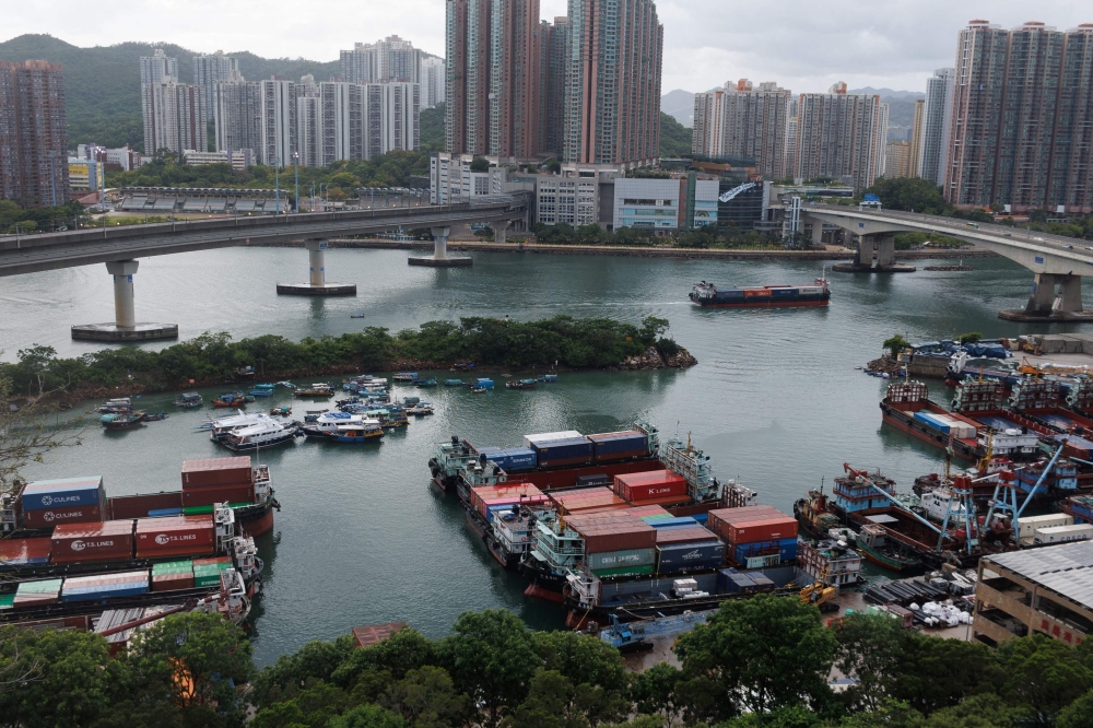 Boats are moored at a typhoon shelter in Tseun Wan as a precaution for the approaching Typhoon Talim in Hong Kong on July 16, 2023. (Photo by May James / AFP)