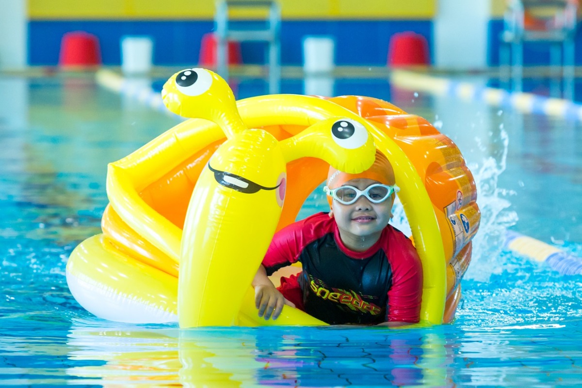 A child taking swiming lessons as part of QF’s Ability Friendly Summer Camp