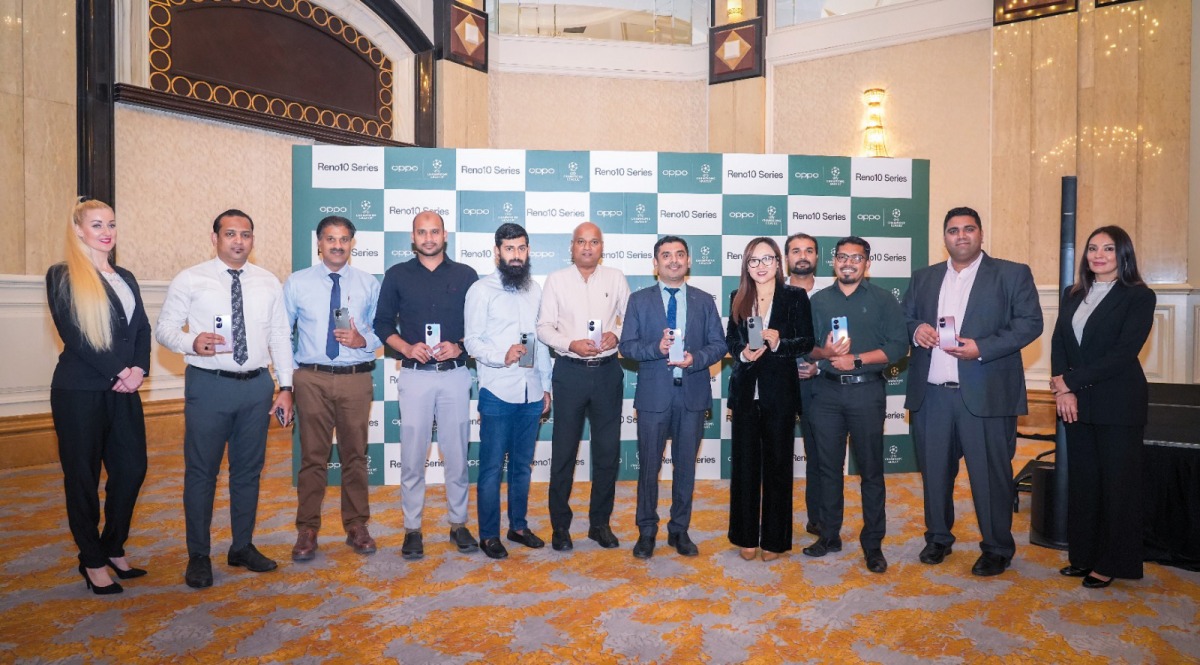 Officials pose for a group photo during the launch of Reno10 series.