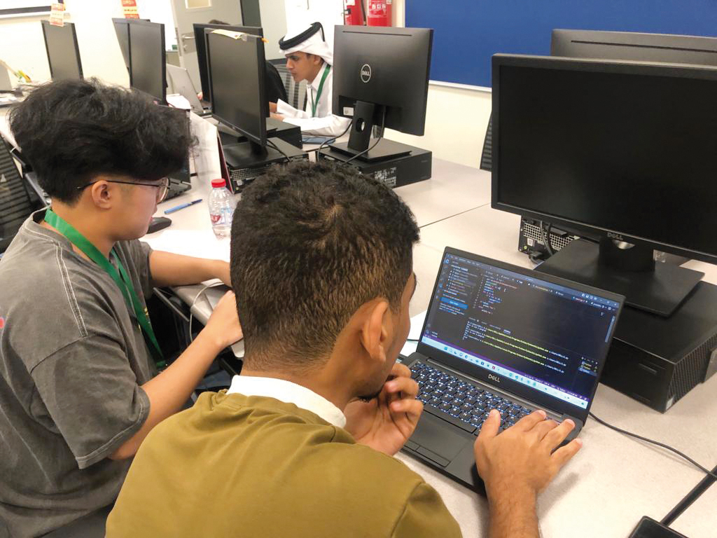 QU students Marcus Wein Esmiller Monteiro, and Galal Faez Salem Ban Amr during the event.