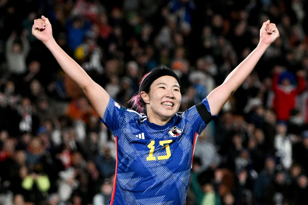 Japan's midfielder #07 Hinata Miyazawa celebrates scoring the team's third goal during the Australia and New Zealand 2023 Women's World Cup Group C football match between Zambia and Japan at Waikato Stadium in Hamilton on July 22, 2023. (Photo by Saeed KHAN / AFP)