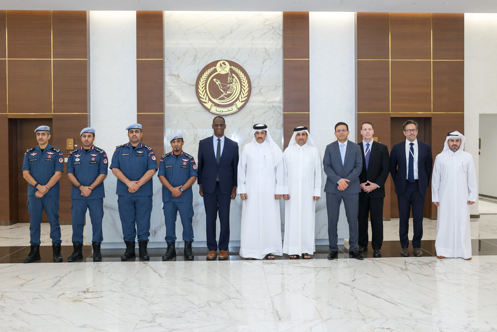 US Ambassador H E Timmy T Davis (fifth left) with Qatari and US officials during the workshop. 