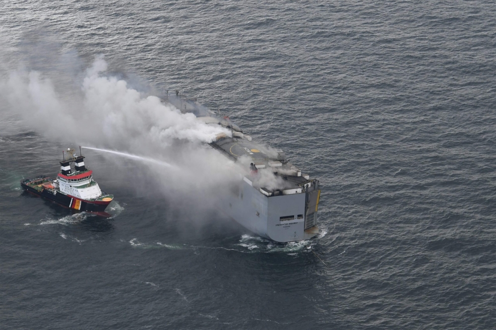 This handout photograph taken and released on July 26, 2023 by the Dutch coastguards, shows a fire aboard the Panamanian-registered car carrier ship Fremantle Highway, off the coast of the northern Dutch island of Ameland. Photo by Handout / Netherlands Coastguards / AFP