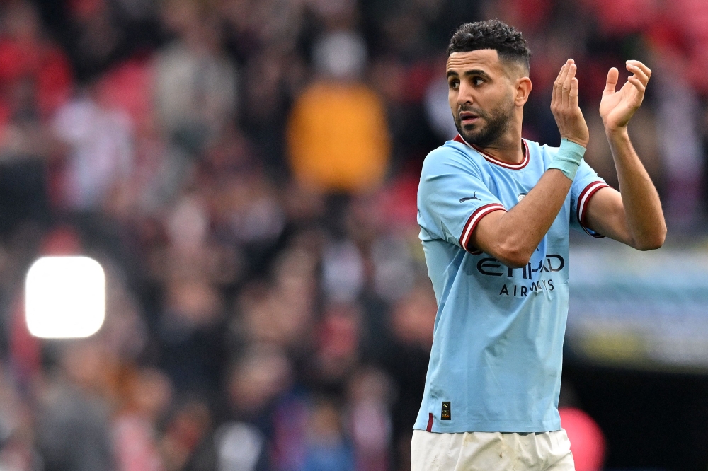Manchester City's Algerian midfielder Riyad Mahrez applauds the fans following the English FA Cup semi-final football match between Manchester City and Sheffield United at Wembley Stadium in north west London on April 22, 2023. Photo by Glyn KIRK / AFP