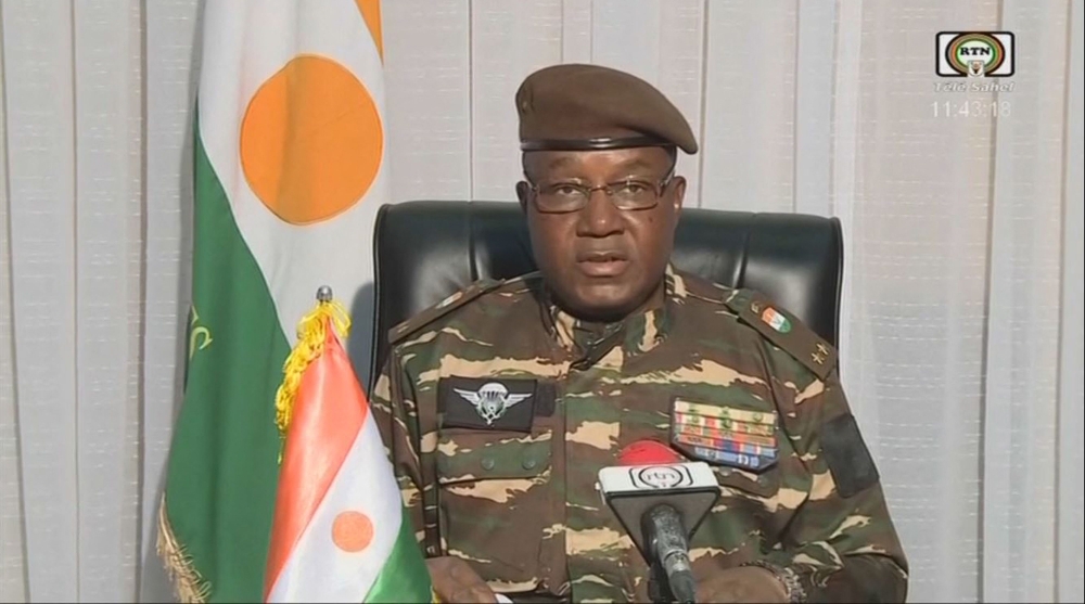 This video frame grab image obtained by AFP from ORTN - Télé Sahel on July 28, 2023 shows General Abdourahamane Tchiani, Niger’s new strongman, speaking on national television and reads a statement as 