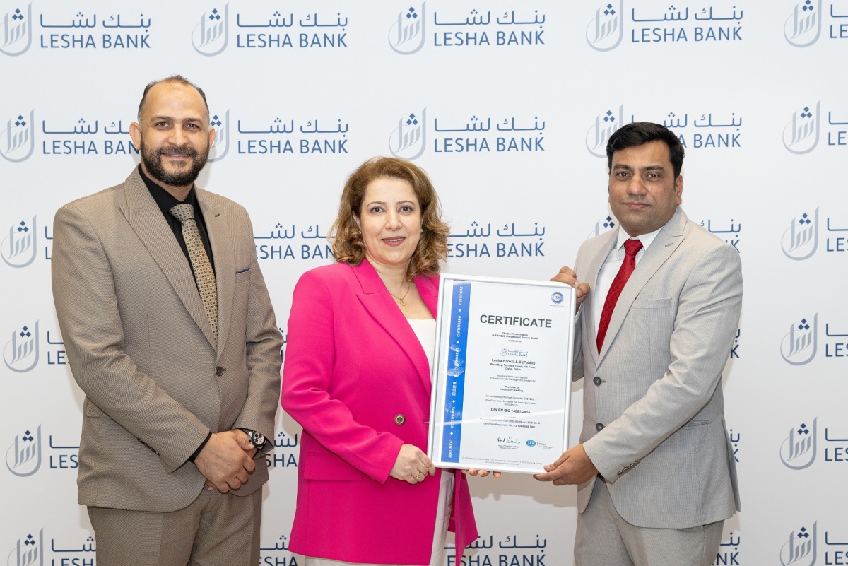 Lesha bank CRO Fulya Plas and Head of Corporate Services Ahmed Abou Elela receives the ISO certification from Mr. Manadar Pagare (Business Manager- TÜV SÜD)