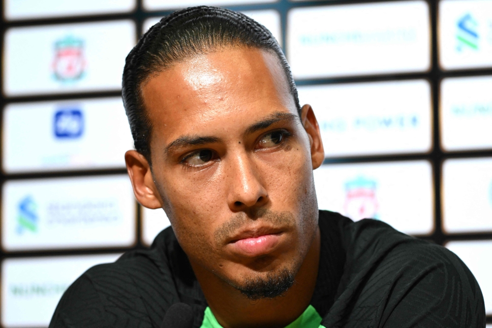 Liverpool's Dutch defender Virgil van Dijk listens to a question during a press conference at the Singapore Festival of Football in Singapore on July 29, 2023. (Photo by Mohd RASFAN / AFP)
