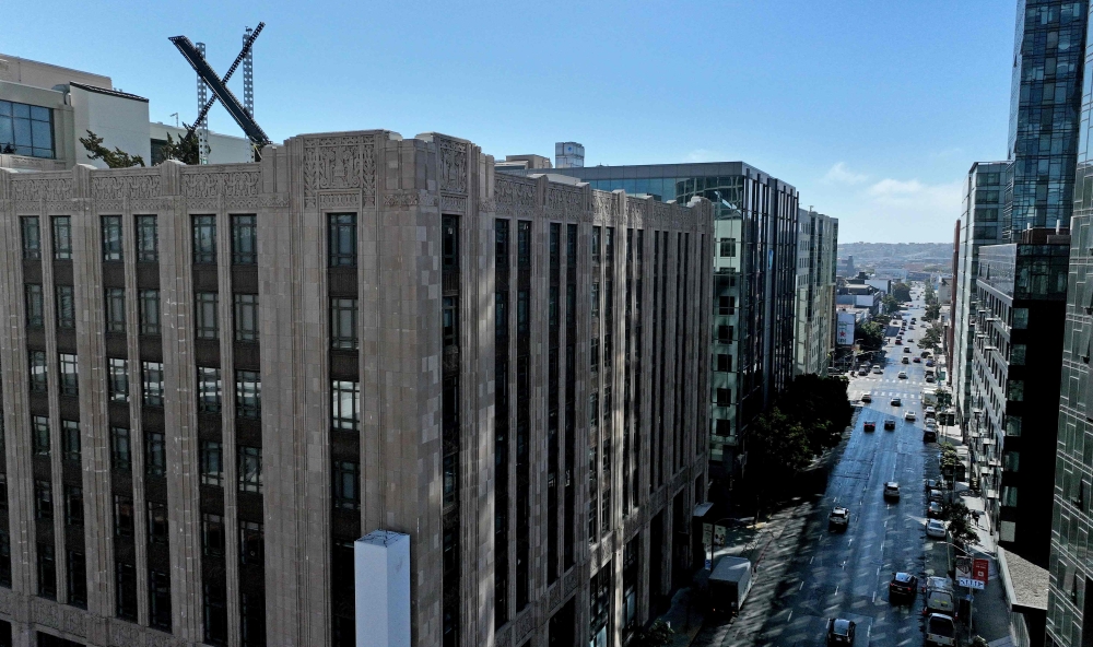 A large X logo is visible on the roof of X headquarters on July 31, 2023 in San Francisco, California. Justin Sullivan/Getty Images/AFP 
