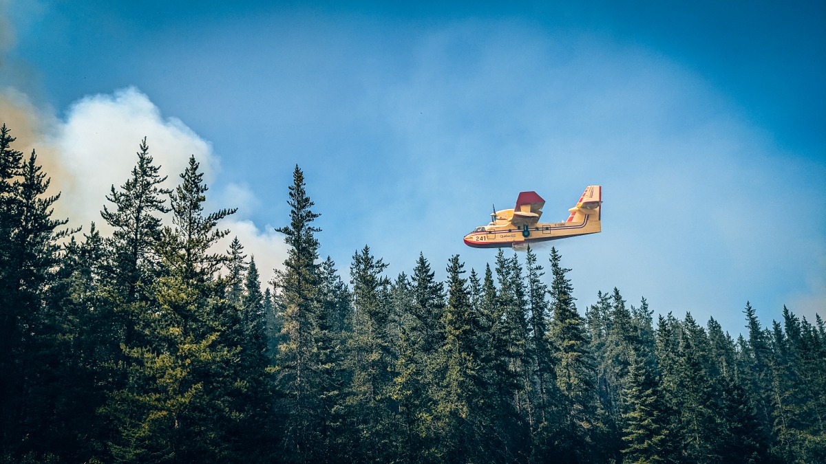 This July 21, 2023, image released by the Societe De Protection Des Forets (SOPFEU) on shows a firefighting plane battling Fire 593 in central Quebec Province, Canada. Photo by Jesse Larriviere / Societe De Protection Des Forets / AFP