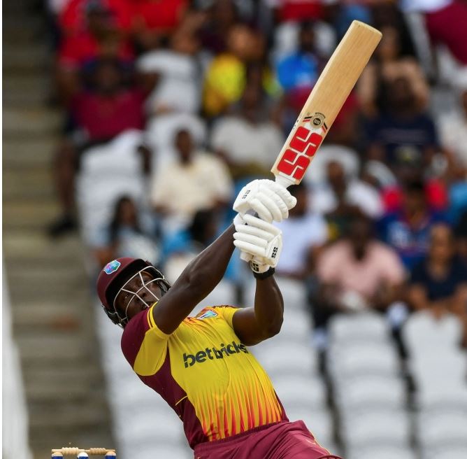 Rovman Powell of West Indies hits 6 during the first T20I match between West Indies and India at Brian Lara Cricket Academy in Tarouba, Trinidad and Tobago, on August 3, 2023. (Photo by Randy Brooks / AFP)