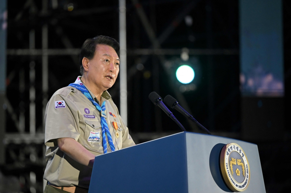 This handout photo taken on August 2, 2023 and made available by the South Korean presidential office on August 3 shows South Korea's President Yoon Suk Yeol delivering a welcoming speech during the opening ceremony of the 25th World Scout Jamboree in Saemangeum, about 180 km southwest of Seoul.