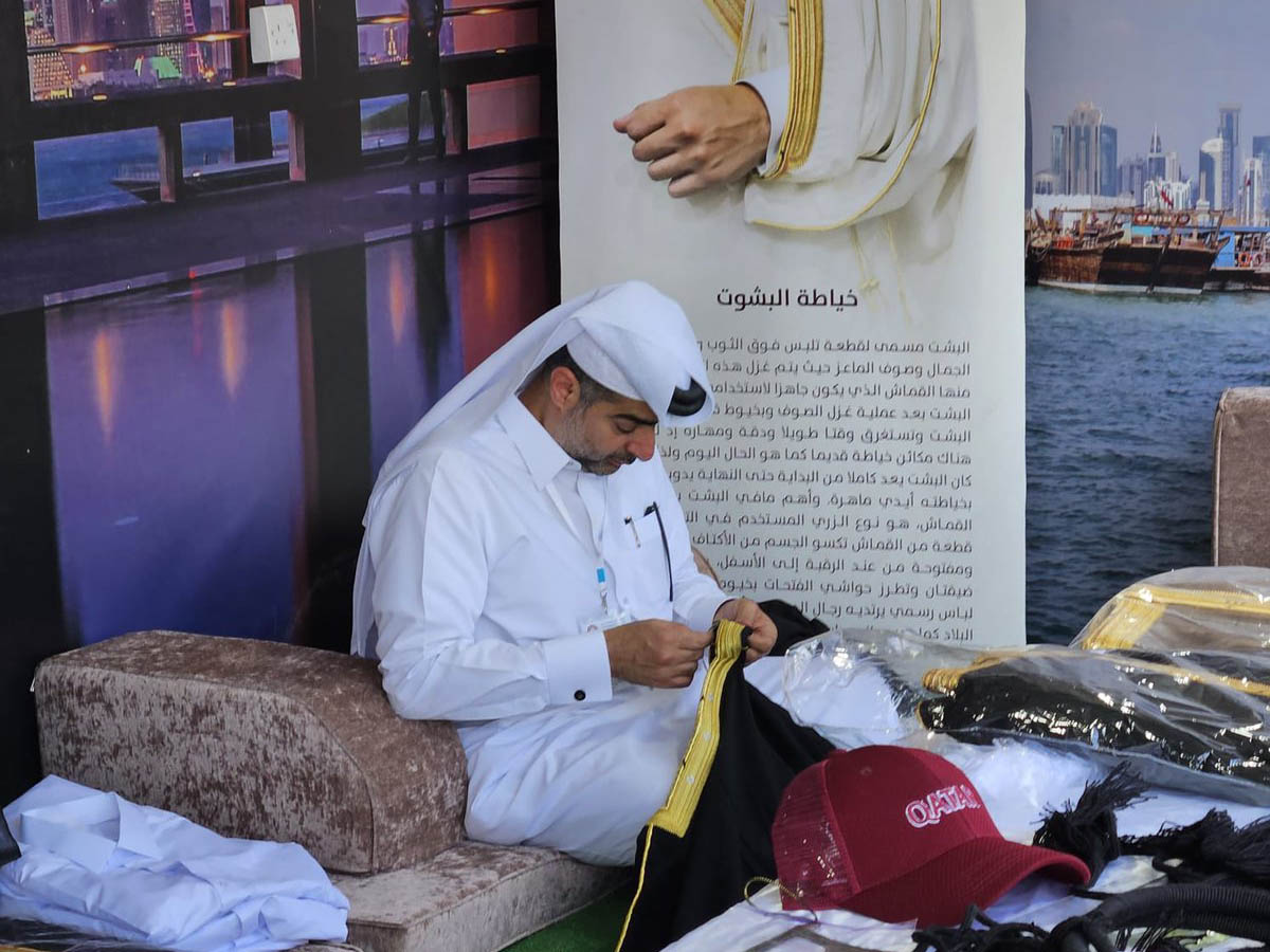 A craftsman works at Qatar's pavilion.
