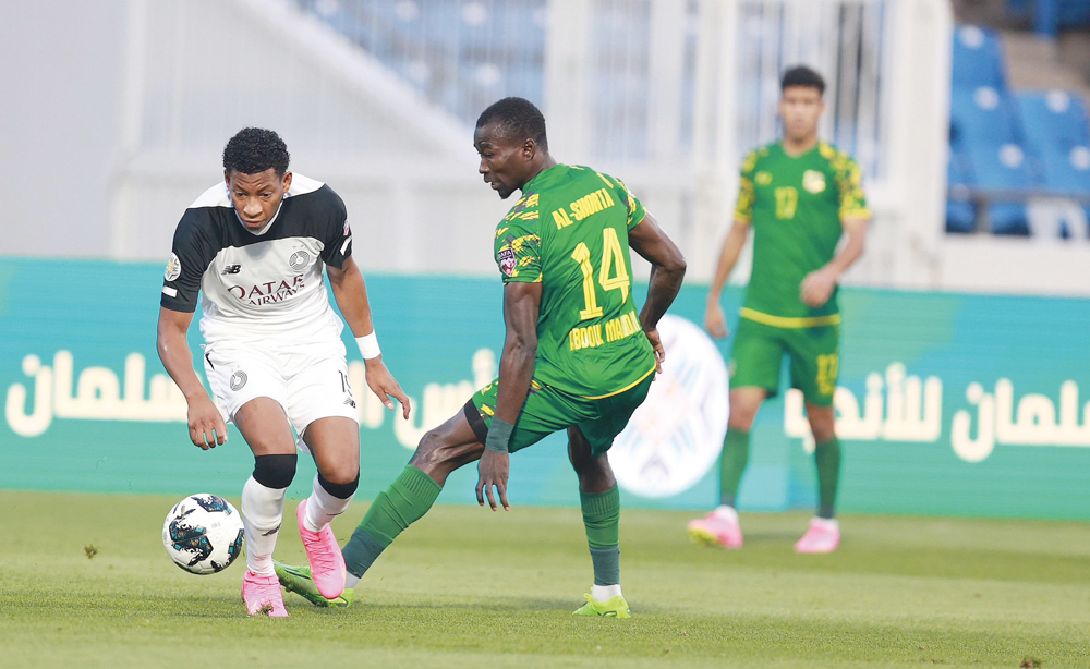 Al Sadd's Gonzalo Plata (LEFT) vies for the ball possession with Al Shorta's Abdoul Madjid Moumouni during yesterday's quarter-final match.