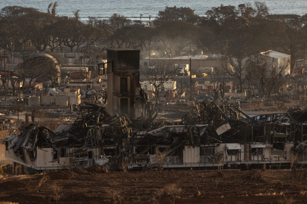 Burned houses and buildings are pictured in the aftermath of a wildfire, is seen in Lahaina, western Maui, Hawaii on August 12, 2023. Photos by Yuki IWAMURA / AFP