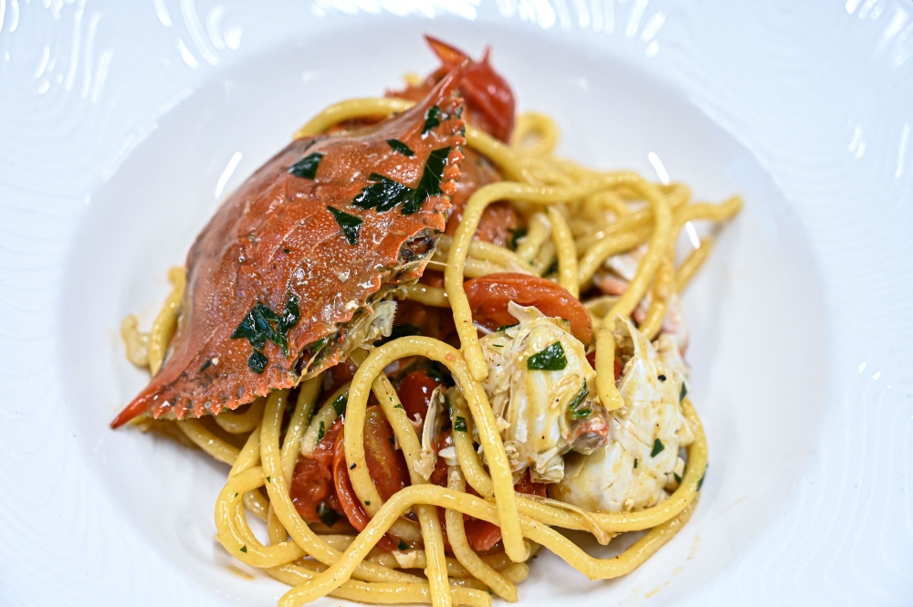 Picture of a dish of pasta with blue crab meat harvested in the Scardovari lagoon, taken at Chef Luca Faraon's holiday farm restaurant in Eraclea, near Venice, Italy on August 11, 2023. (Photo by Piero Cruciatti / AFP)