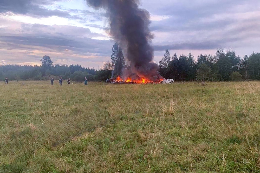 This photograph posted on a Wagner linked Telegram channel @grey_zone on August 23, 2023, that AFP was able to authenticate, reportedly shows a wreckage of a burning plane near the village of Kuzhenkino, Tver region. (Photo by Handout / TELEGRAM/ @grey_zone / AFP)