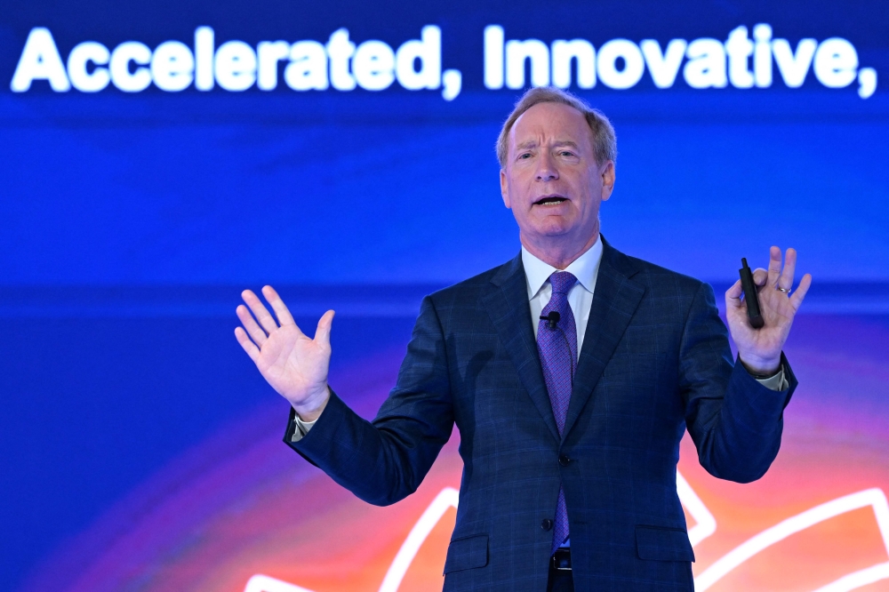 Brad Smith, President and Vice Chairman of Microsoft, addresses the gathering on the first day of the three-day B20 Summit in New Delhi on August 25, 2023. (Photo by Sajjad Hussain / AFP)