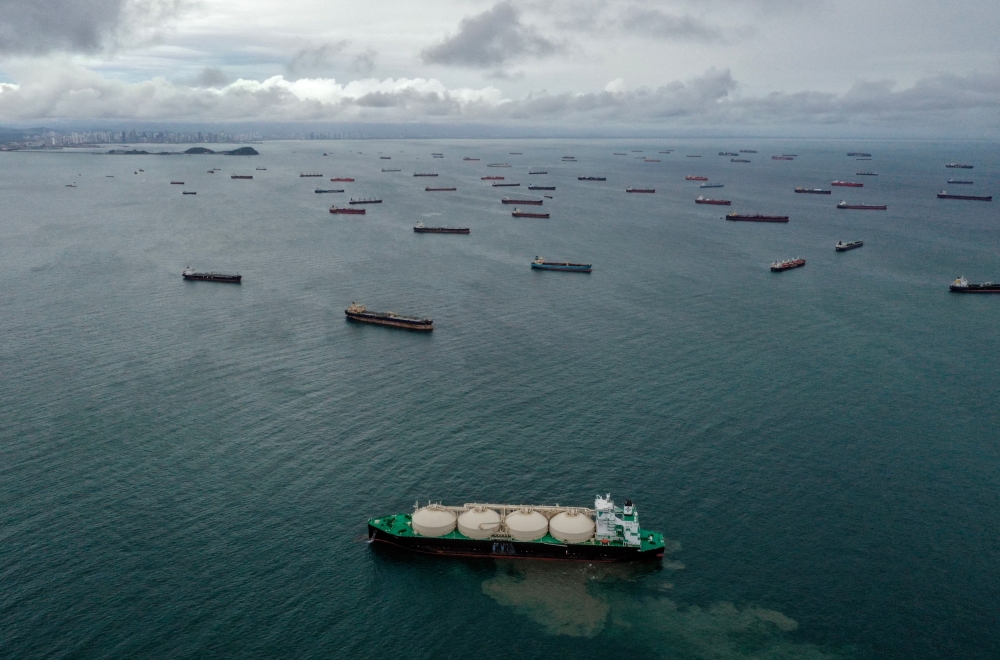 Aerial view of cargo ships waiting at the entrance of the Panama Canal at Panama Bay off Panama City, on Aug 23, 2023. (Photo by Luis Acosta / AFP)