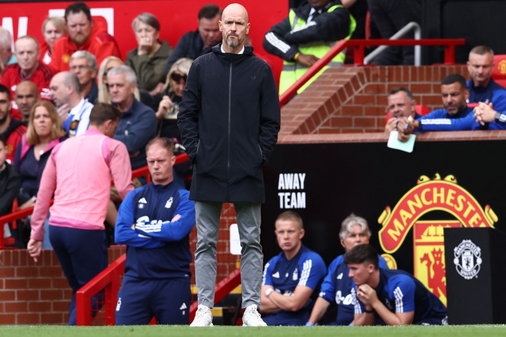 Manchester United's Dutch manager Erik ten Hag observes players during the English Premier League football match between Manchester United and Nottingham Forest at Old Trafford in Manchester, northwest England, on August 26, 2023. (Photo by Darren Staples / AFP)