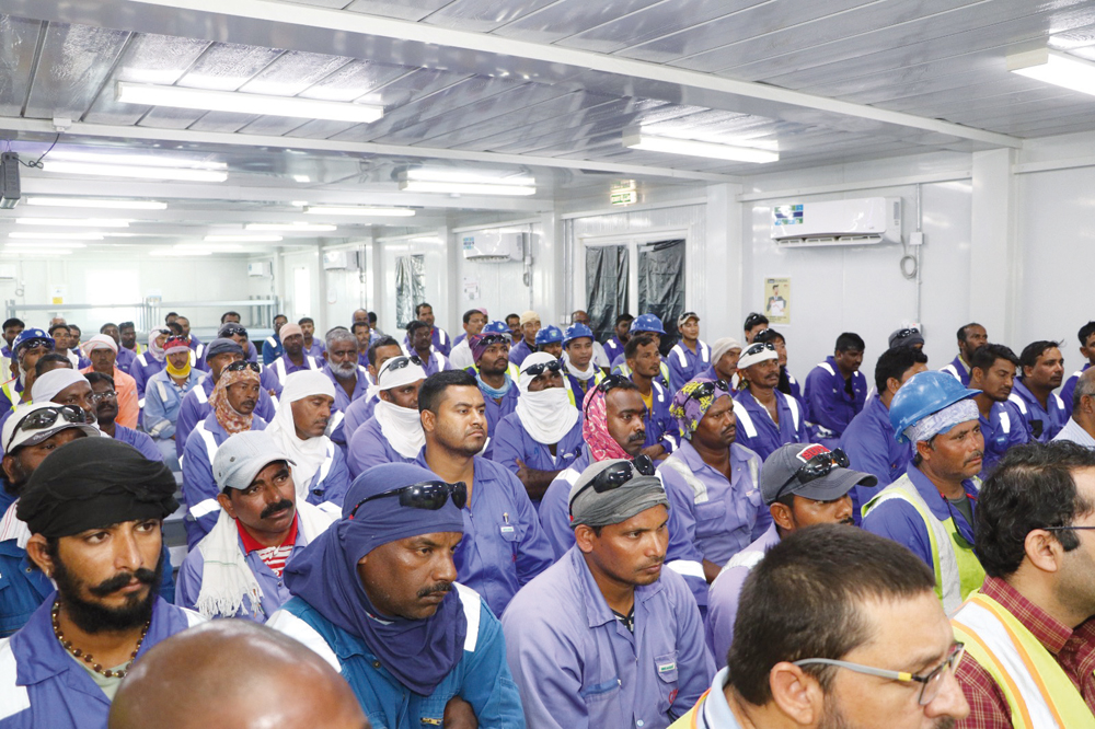 Workers attend an awareness session on heat stress safety. 