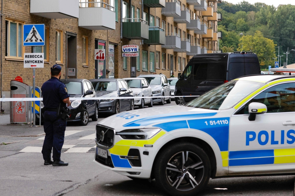 Police is seen at the site of an explosion in Olskroken in Gothenburg, Sweden, August 31, 2023. (Photo by Adam IHSE / TT News Agency / AFP) 