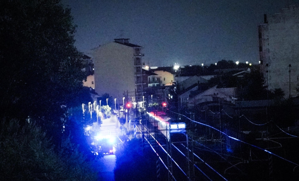 Rescue vehicles are seen along the railway outside the train station of Brandizzo where five railway workers died after being hit by a train during overnight maintenance on August 31, 2023. Photo by Tino ROMANO / AFP