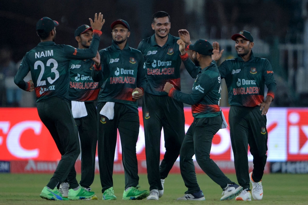 Bangladesh's players celebrate after winning the Asia Cup 2023 one-day international (ODI) cricket match between Bangladesh and Afghanistan at the Gaddafi Stadium in Lahore on September 3, 2023. (Photo by Asif Hassan / AFP)