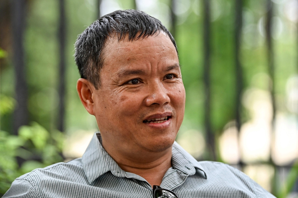 Vietnam's journalist Le Anh Hung, sentenced to five years in jail, gives an interview in Hanoi on September 5, 2023. (Photo by AFP) 