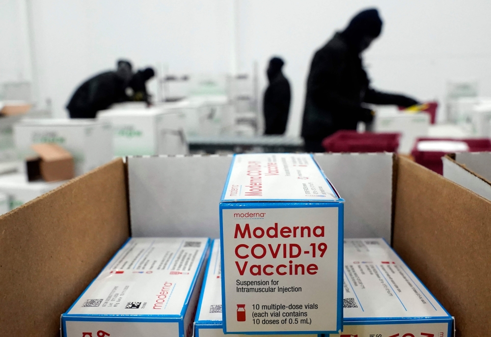 (Files) Boxes containing the Moderna Covid-19 vaccine are prepared to be shipped at the McKesson distribution center in Olive Branch, Mississippi, on December 20, 2020. (Photo by Paul Sancya / POOL / AFP)