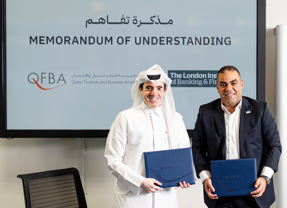 Director of Training & Development at QFBA, Majid Al Khulaifi with Managing Director at LIBF MENA, Kareem Refaay at the signing of MoU.