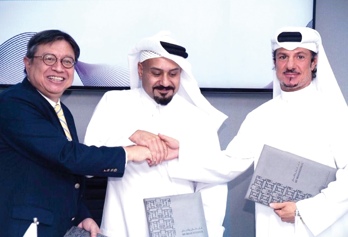 Officials pose for a group photo during the signing of Memorandum of Collaboration.