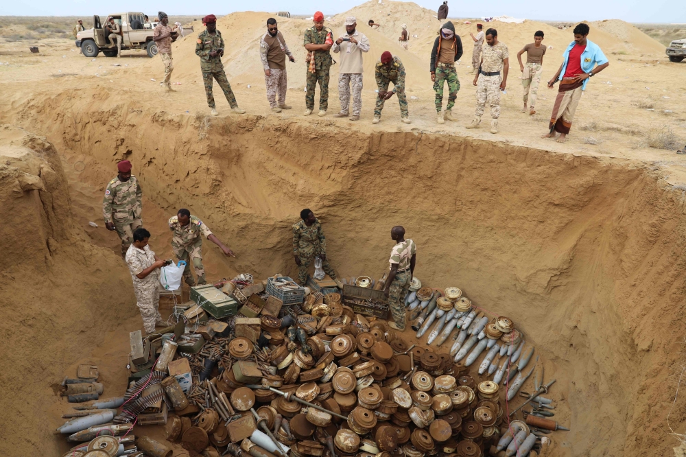 A joint Saudi-backed Sudanese-Yemeni military experts force removes and deactivates some 5,000 landmines on January 30, 2021, which they said were planted by the Iran-aligned Huthi rebels in Yemen's northern coastal town of Midi, located in conflict-ridden Hajjah governorate near the border with Saudi Arabia on the Red Sea. (Photo by AFP)

