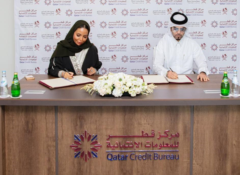 Qatar Credit Bureau CEO, Sheikha Maryam bint Khalifa Al Thani and Ali Abdulrahman Al Muftah on behalf of Al Tadamon Motors & Trading during the signing of agreement.