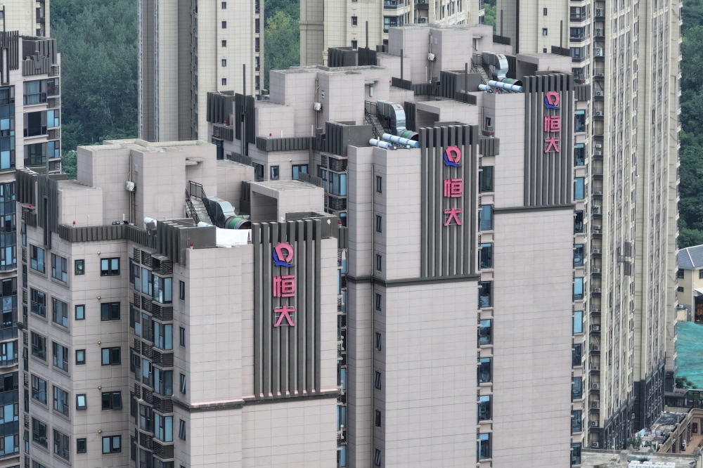 (FILES) The Evergrande logo is seen on residential buildings in Nanjing, in China痴 eastern Jiangsu province on August 18, 2023. (Photo by STRINGER / AFP) / China OUT
