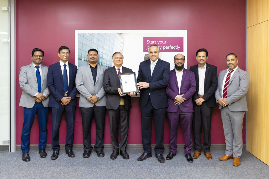 Qatar Airways officials with the IT Service Management System excellence certification.