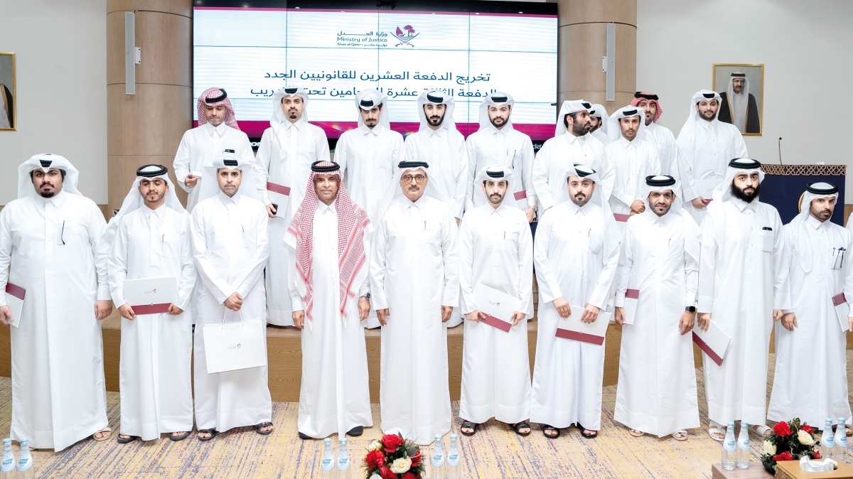 Minister of Justice H E Masoud bin Mohammed Al Ameri with the graduates  during the ceremony.