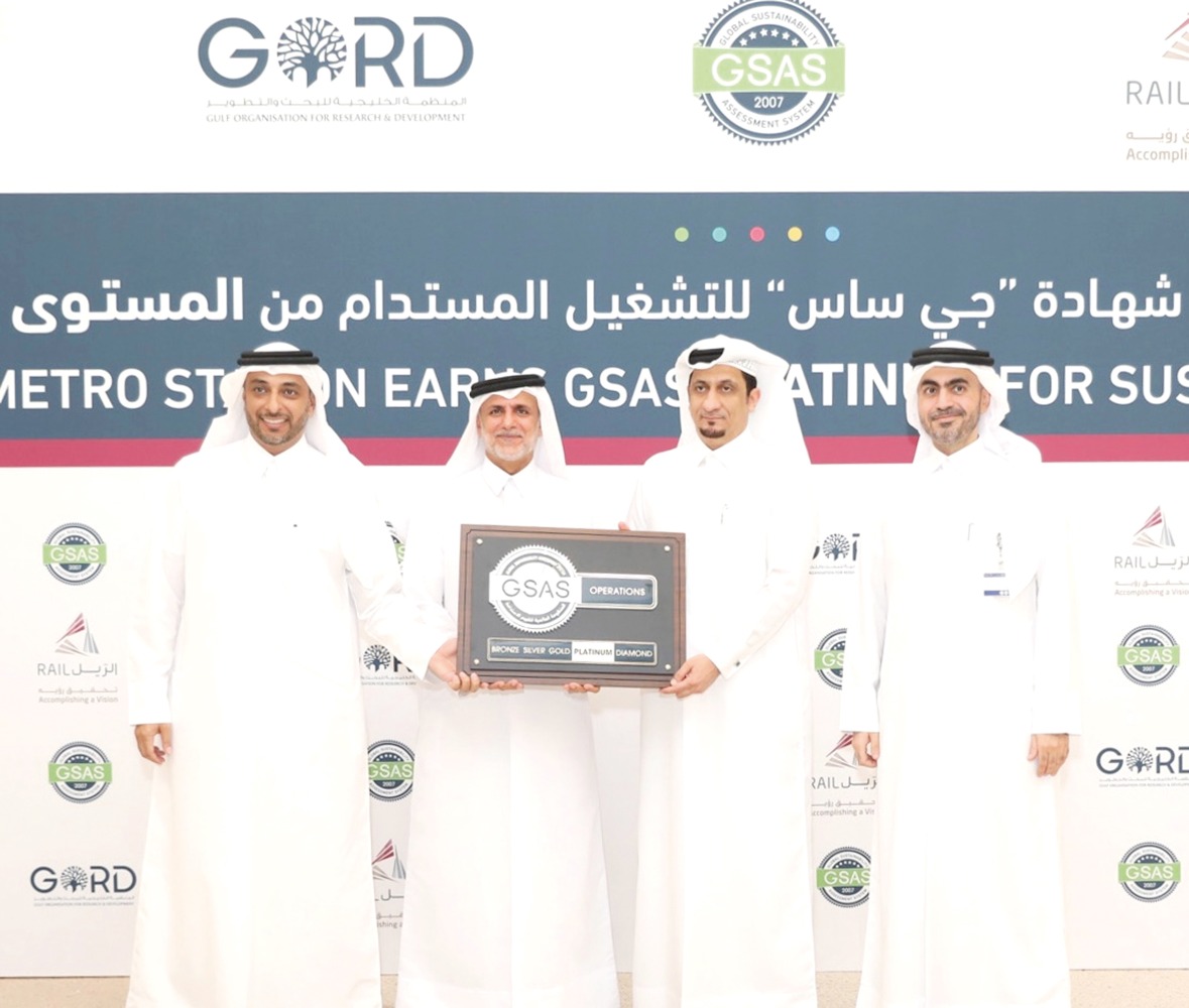 Senior QSHESE Director at Qatar Rail, Eng. Abdulrahman Al Malik and Founding Chairman of GORD, Dr. Yousef Alhorr with other officials during a ceremony to present green building certification.