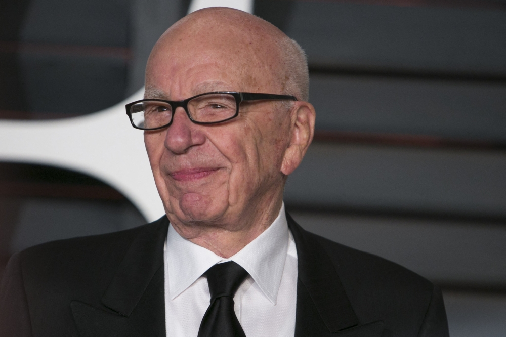 (FILES) This file picture taken on February 22, 2015, shows Rupert Murdoch arriving at the 2015 Vanity Fair Oscar Party in Beverly Hills, California. (Photo by ADRIAN SANCHEZ-GONZALEZ / AFP)
