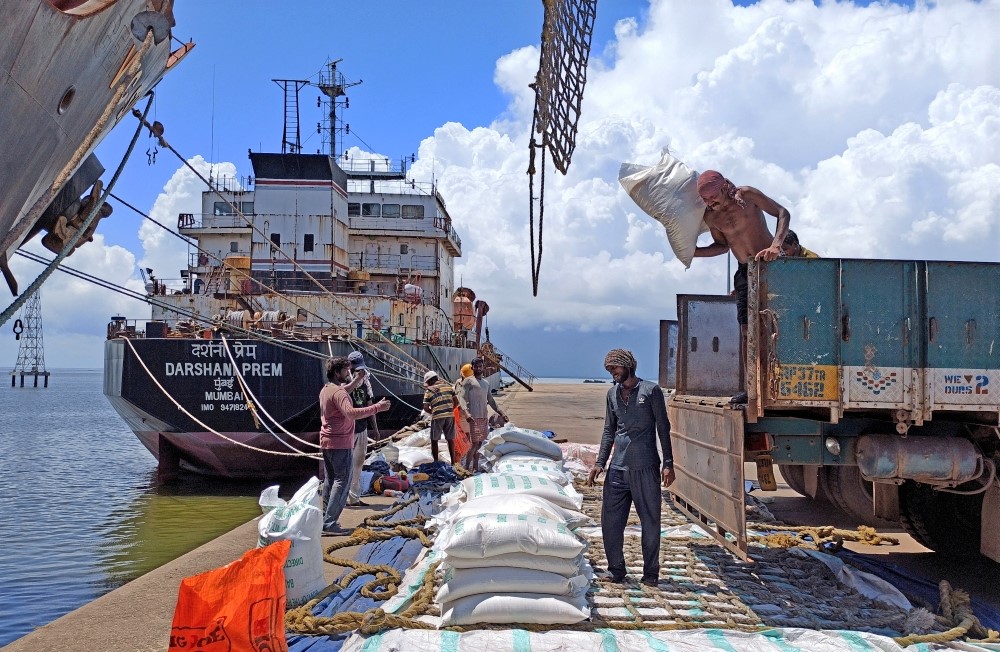 Labourers unload rice bags from a supply truck at India's main rice port at Kakinada Anchorage in the southern state of Andhra Pradesh, India. (Reuters file photo)
