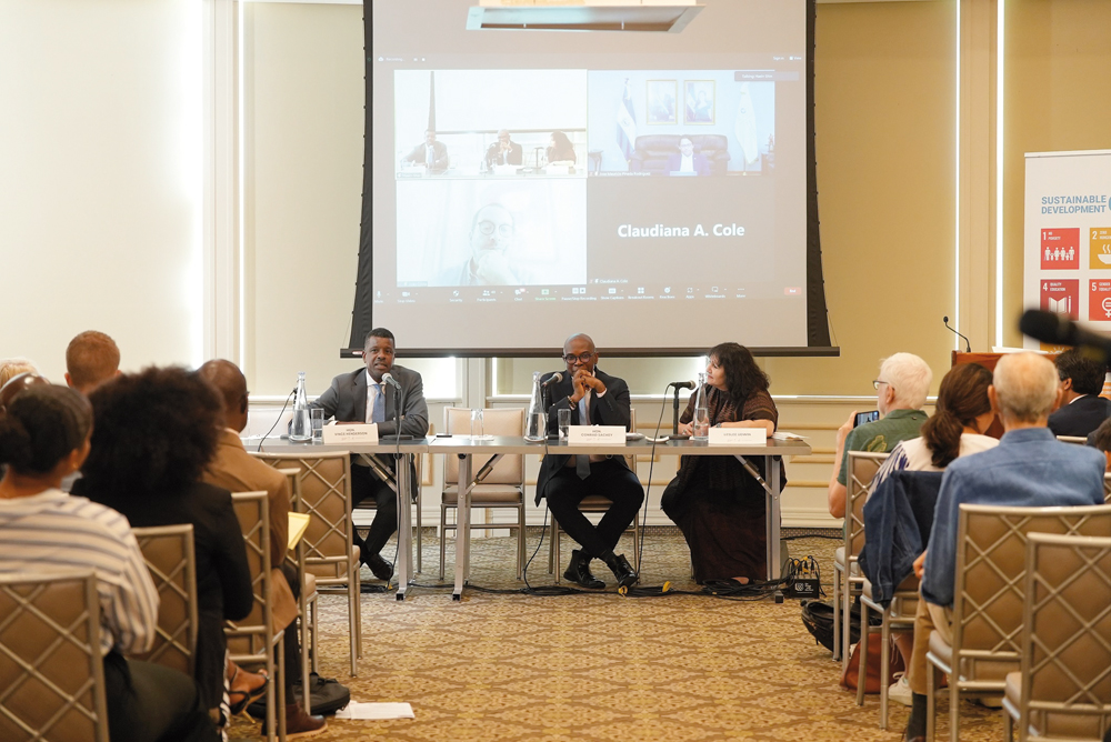 Officials and participants during the discussion.