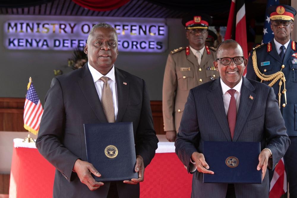 US Defence Secretary, Lloyd's Austin (left) poses alongside Kenya's Cabinet secretary for Defence, Aden Duale with copies of the Defence Coocperation Agreements they signed at a joint press conference at the Defence Headquarter's in Nairobi on September 26, 2023. (Photo by Tony Karumba / AFP)